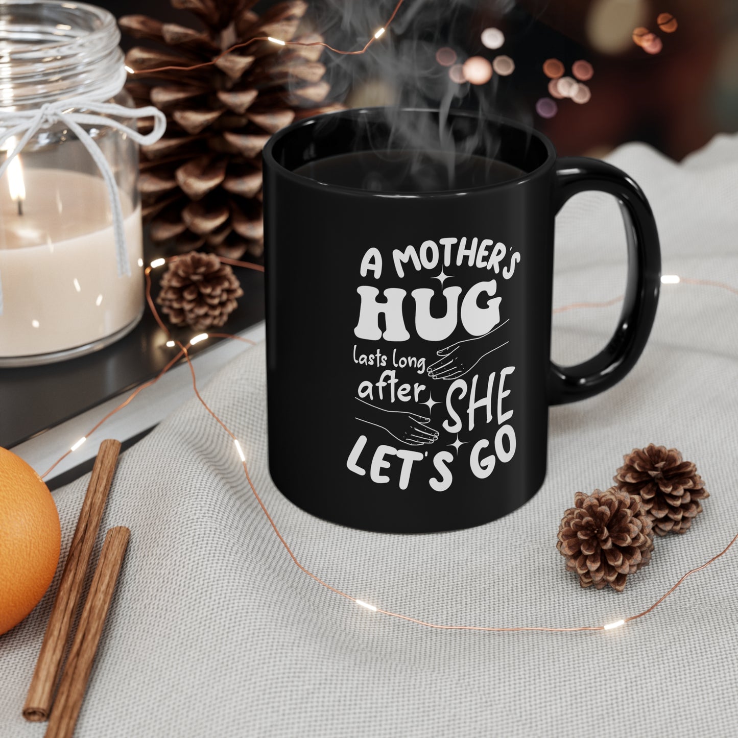 A Mothers hug lasts long after she 11oz Black mug