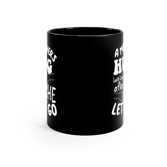 A Mothers hug lasts long after she 11oz Black mug